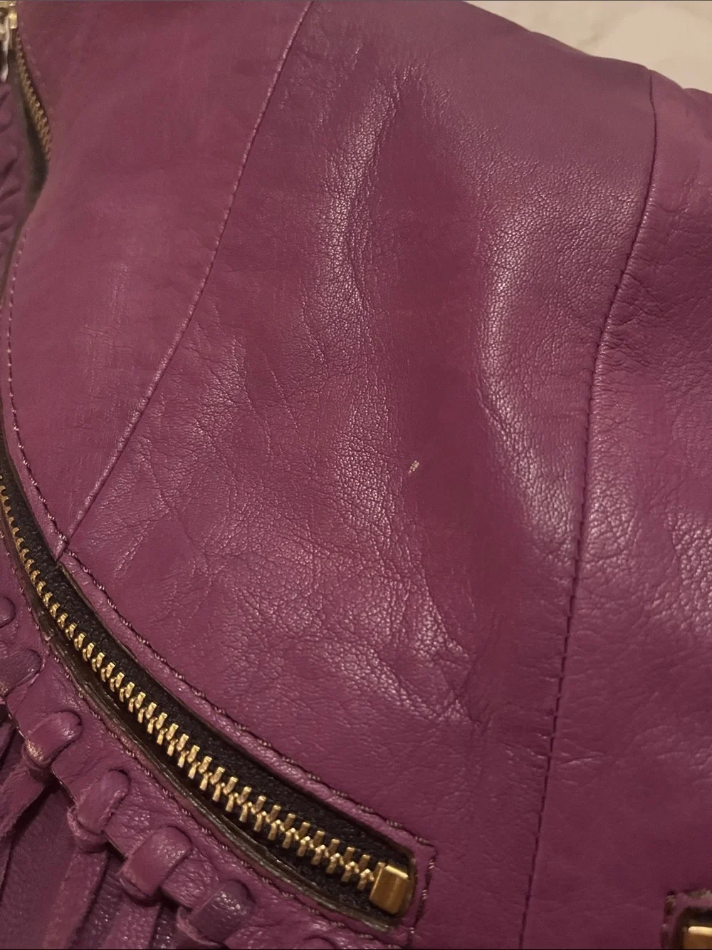 orYANY purple Studded  fringed Leather Hobo Bag with geometric interior material